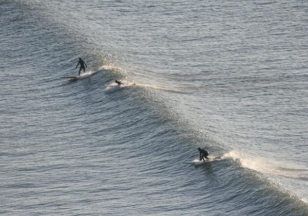 3 Surfers With Sun